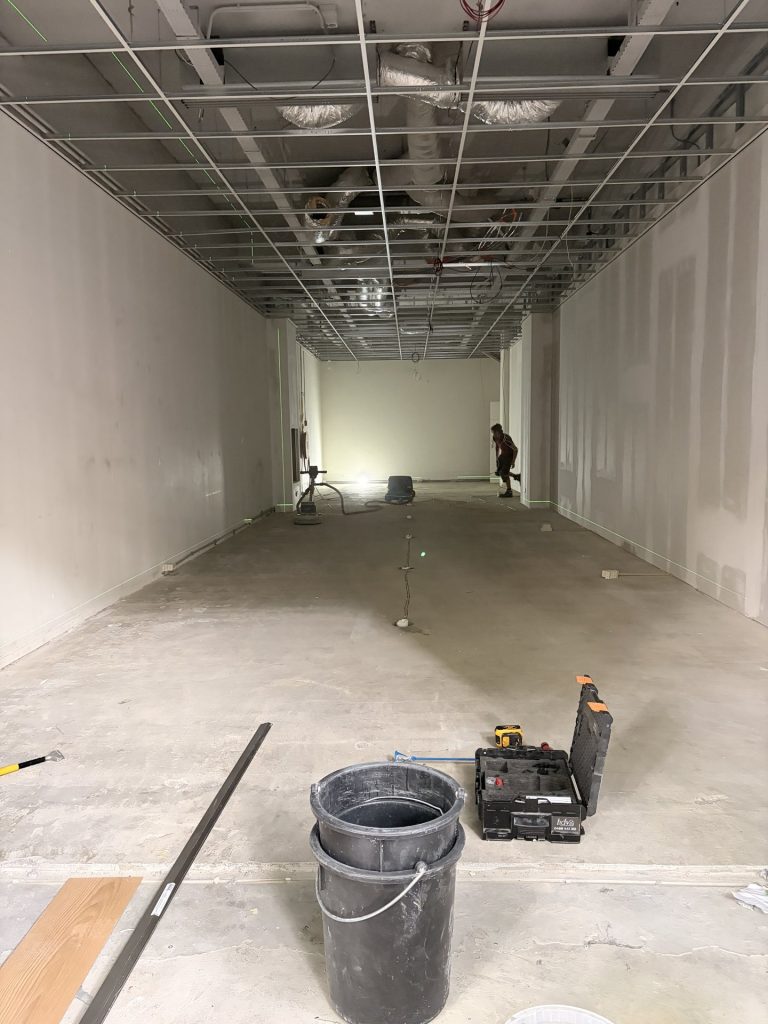 Ceiling grid and plasterboard walls during the Rolife Rotterdam fit-out