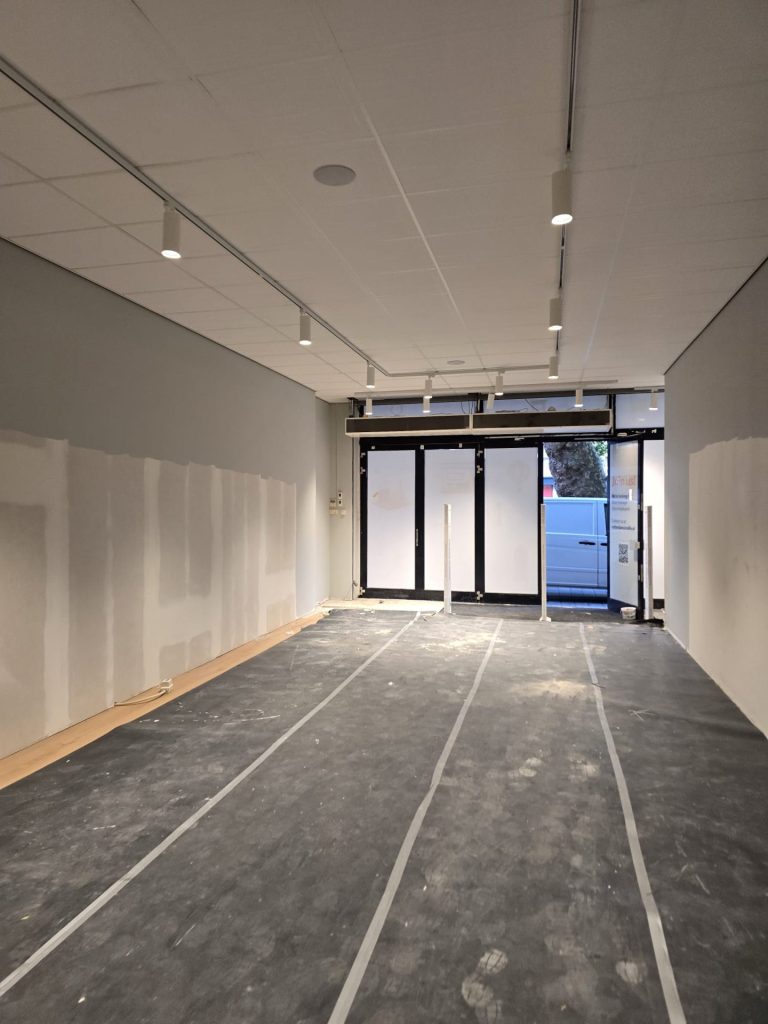 View towards the entrance with suspended ceiling and protected floor at Rolife Rotterdam